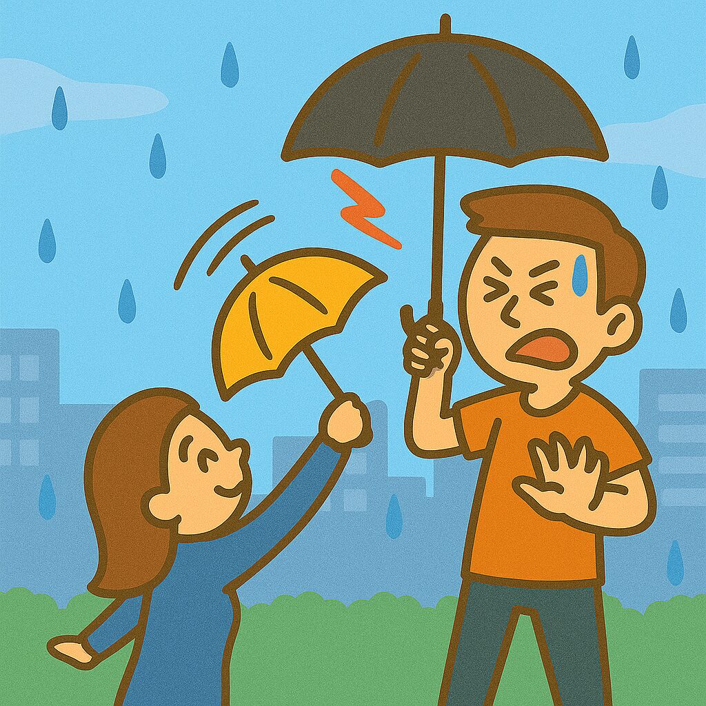 背が高い男性と小柄な女性が雨の日にすれ違い、女性の傘の先が男性の目に迫っているイラスト。 「傘、上げすぎ注意!」 気遣いありがたいけど、危ない!